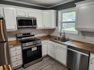 Kitchen with sink, appliances with stainless steel
