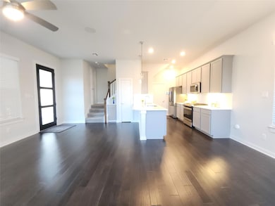 Kitchen featuring stainless steel appliances, dar