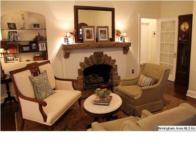 gas fireplace with stone mantle and stone surround