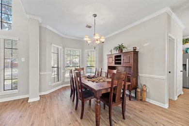 Elegant formal dining room off the foyer.