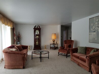 Open concept into the dining area with large windo