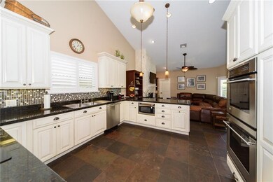Stainless steel appliances with tons of white cabi