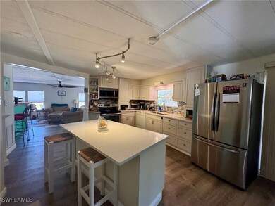 Kitchen featuring stainless steel appliances, ligh