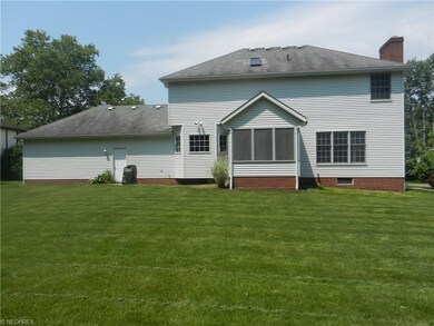 Spacious back yard and enclosed porch
