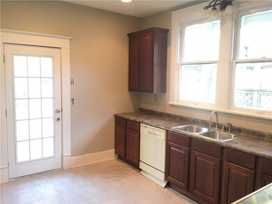 New cabinets, counters, sink, tile and lighting. W