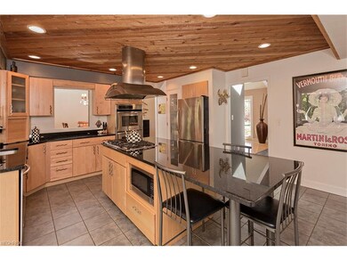 Large updated kitchen with granite countertops is 