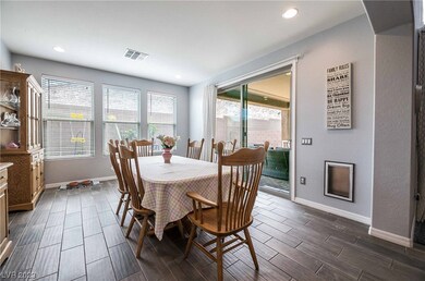 Spacious dining area features 8' sliding door to o