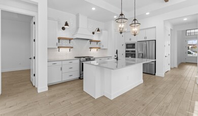 Kitchen with quartz countertop & island