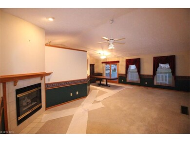View of great room and dining area from foyer. Ver