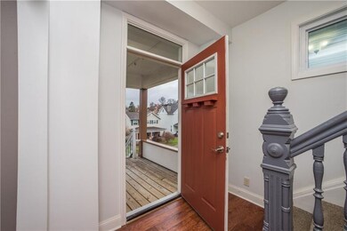 The new craftsman style front door leads inside fr
