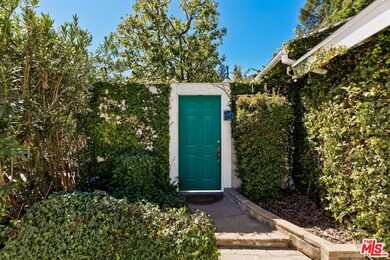 Door from driveway to private front yard