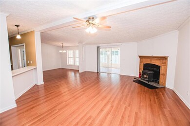 Unfurnished living room with ceiling fan with nota