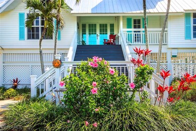 View of front of home with a fenced front yard, a