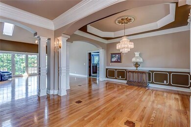 Entrance opens to a bright, open floor plan. Look at all the Red Oak sand & stain hardwood flooring with custom inlays.