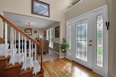 Entryway looking at formal dining room that owner'