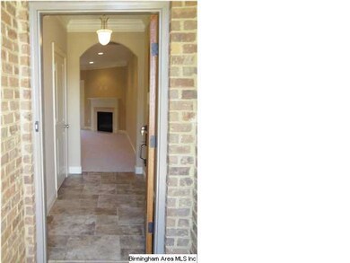 Tiled entrance with detailed crown molding in the 