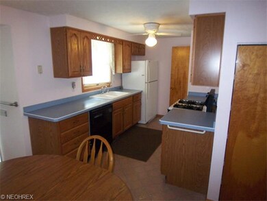 This is the kitchen  with beautiful oak cabinets.