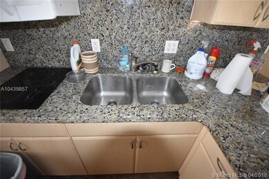 Updated kitchen with granite, stainless, cabinets.