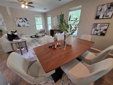 Dining area featuring wood finished floors and ce