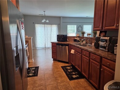 Kitchen featuring appliances with stainless steel