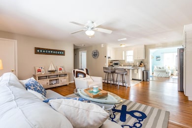 Living room opens to kitchen:family room