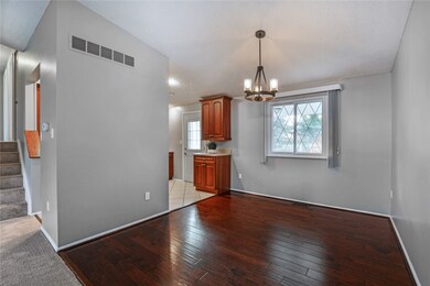 Beautiful hardwood floors are displayed in the dining room.