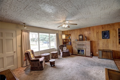 Living Room 2 -spacious, lots of natural light; natural wood-burning fireplace