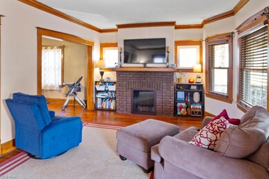 Living Room opens to the Dining Room - nice brick fireplace with glass front