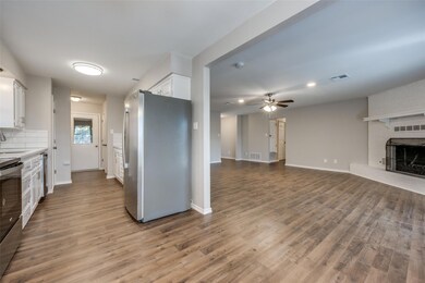Kitchen featuring stainless steel appliances, wood