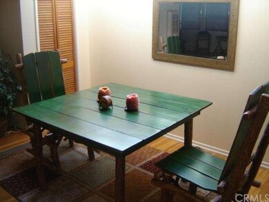 Woodsy dining room appeal, lit by skylights! Beaut