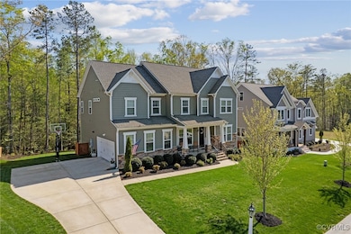 Craftsman inspired home with a front lawn, concret
