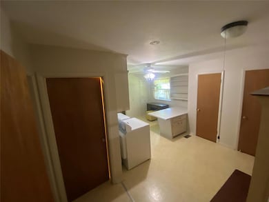 Laundry room with a ceiling fan
