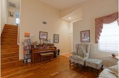 Living Room view of Stair Case entry.