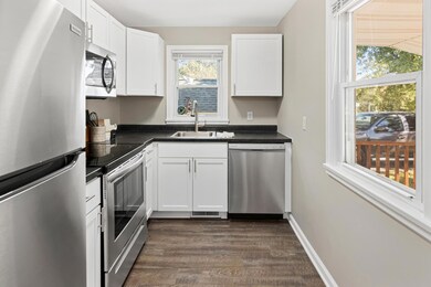 This light and bright kitchen features a neutral color palette and will work with so many different styles of decor.  Brand new shaker style cabinets, countertops, sink & faucet and appliances make this a welcoming space to work in.