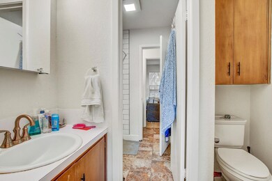 Bathroom featuring vanity and stone finish floors
