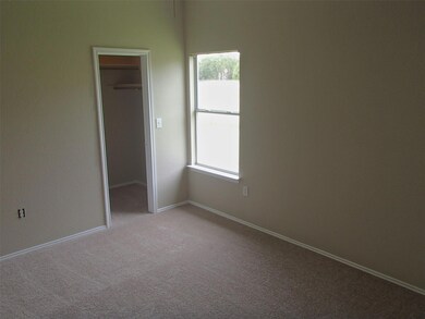 Unfurnished bedroom with multiple windows, carpet