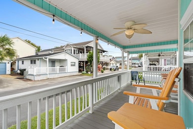 Wooden terrace featuring a residential view and a ceiling fan