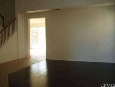 Living room look towards family room and kitchen
