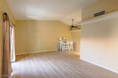 Spare room with ceiling fan, wood finished floors,