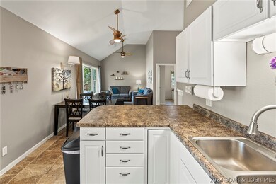 Open floor plan with vaulted ceiling