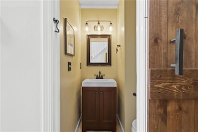 Half bath in hallway leading to great room