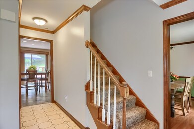The gracious foyer has a large coat closet.