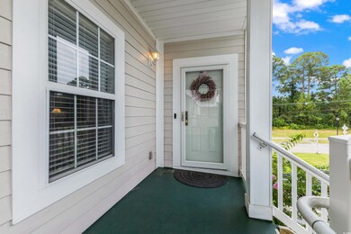 View of exterior entry featuring a porch
