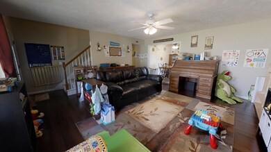 Huge living room with gorgeous new dark hardwood floors!