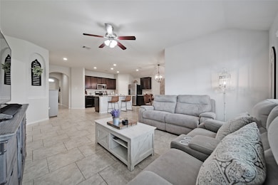 open living that over looks backyard and kitchen