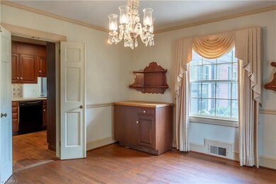 Panning around in the dining room with a glimpse into the kitchen.
