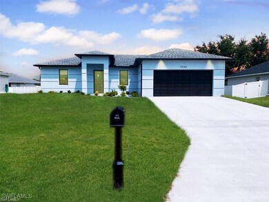 View of front of house with concrete driveway, a g