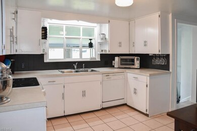 Updated kitchen with tile flooring.