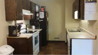 Kitchen has a lovely tile floor.
