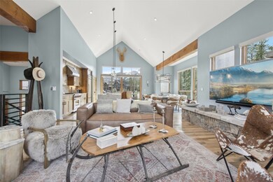 Living area with light wood-type flooring, high va